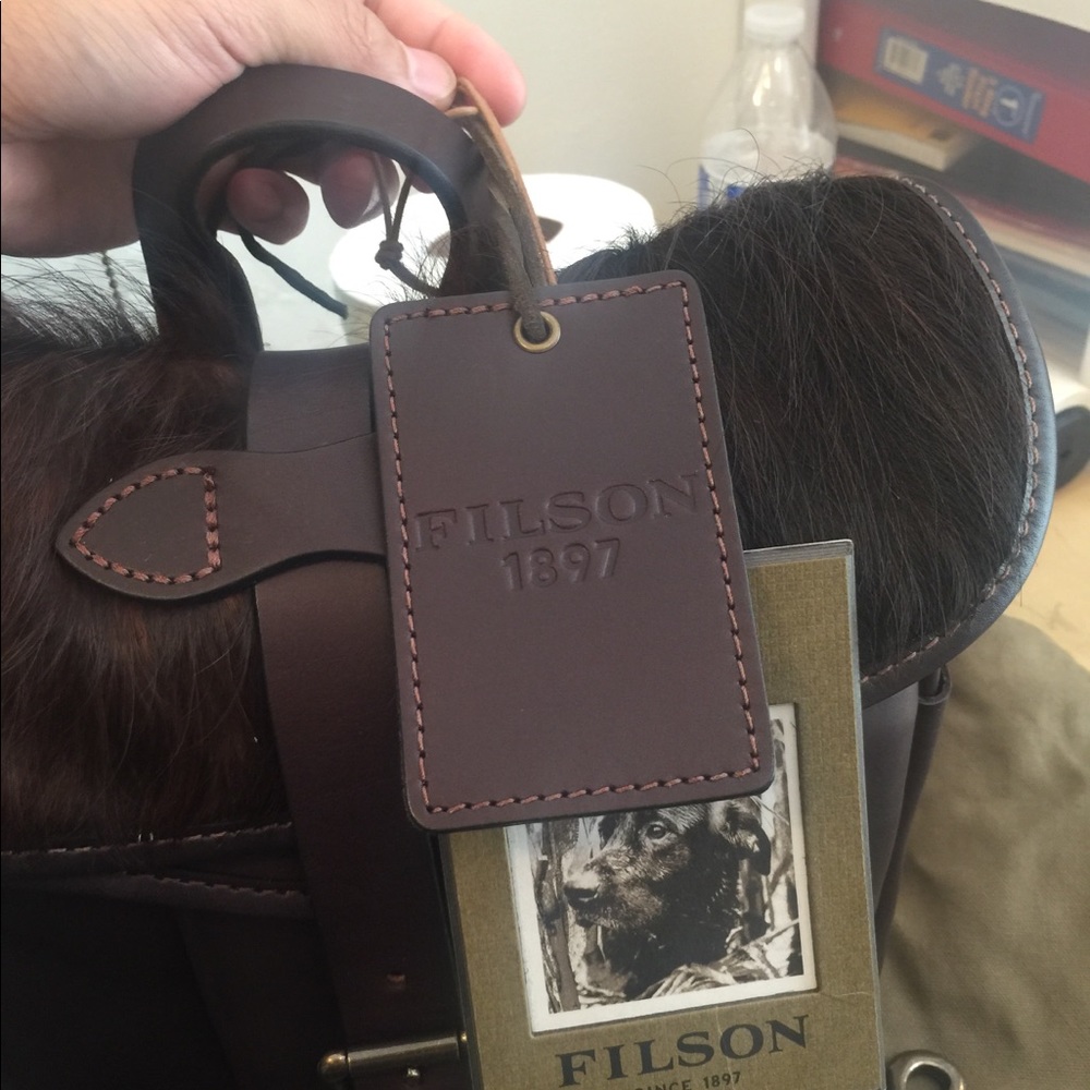 Filson leather waterproof bag